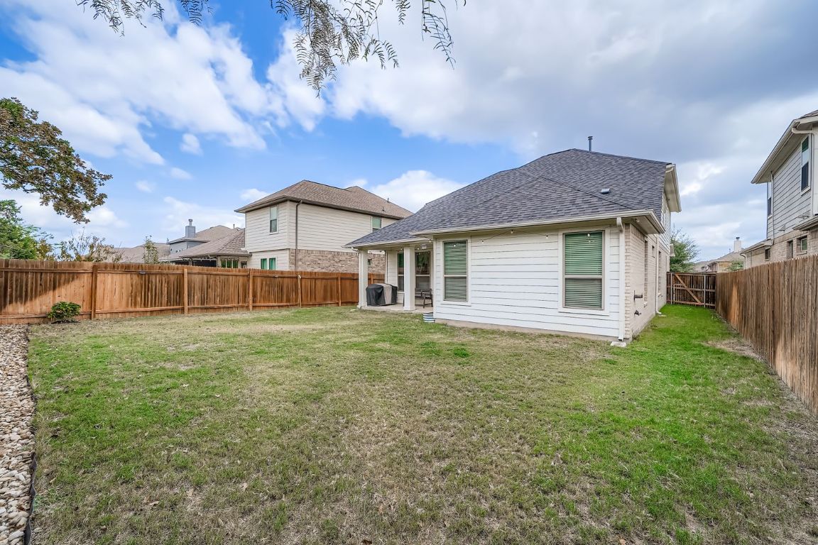 324 Clear Frk Loop Liberty Hill, TX 78642 - Photo 27 of 28 a view of a house with backyard and garden