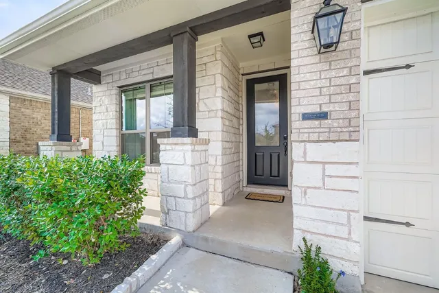 a front view of a house with a porch