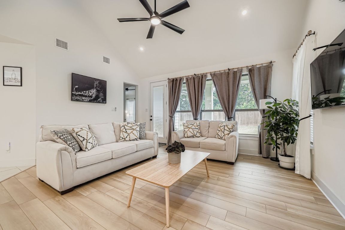 324 Clear Frk Loop Liberty Hill, TX 78642 - Photo 5 of 28 a living room with furniture and a flat screen tv