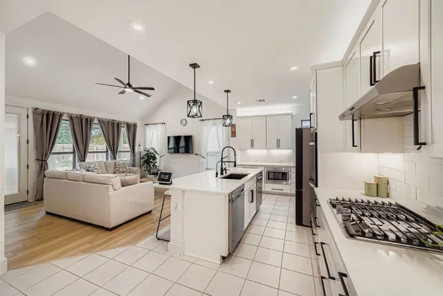 a living room with furniture and a rug