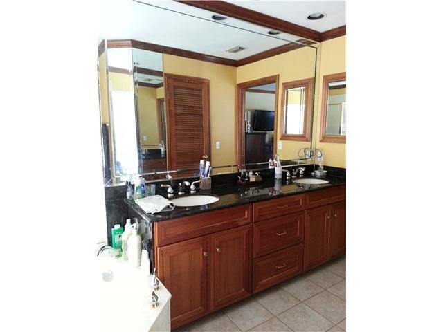 12757 Sandy Run Road Jupiter, FL 33478 - Photo 14 of 25 a bathroom with a sink and a mirror