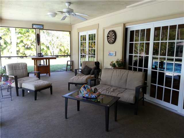 12757 Sandy Run Road Jupiter, FL 33478 - Photo 20 of 25 a living room with furniture and a large window
