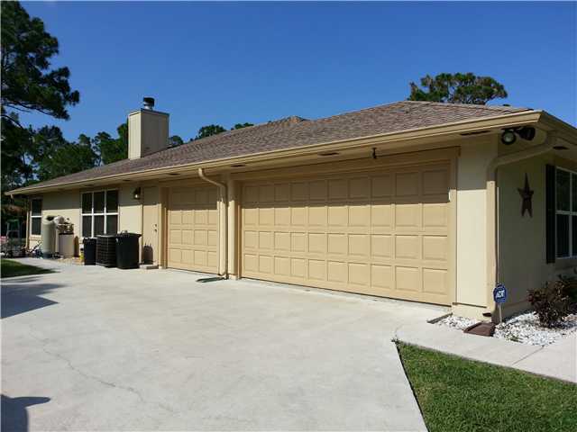 12757 Sandy Run Road Jupiter, FL 33478 - Photo 2 of 25 a view of a house with a patio