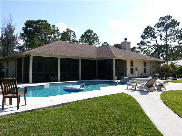 12757 Sandy Run Road Jupiter, FL 33478 - Photo 23 of 25 a house view with a garden space