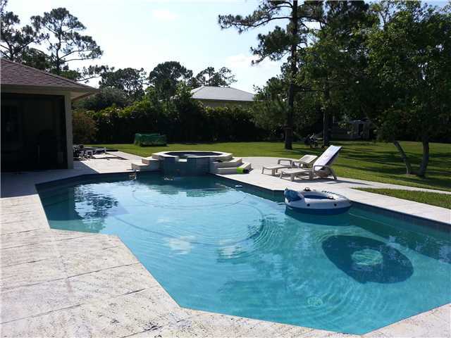 12757 Sandy Run Road Jupiter, FL 33478 - Photo 24 of 25 a view of swimming pool with lounge chair