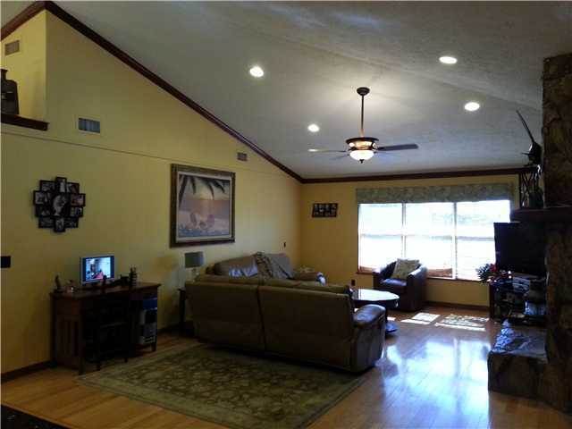 12757 Sandy Run Road Jupiter, FL 33478 - Photo 6 of 25 a living room with furniture and a flat screen tv