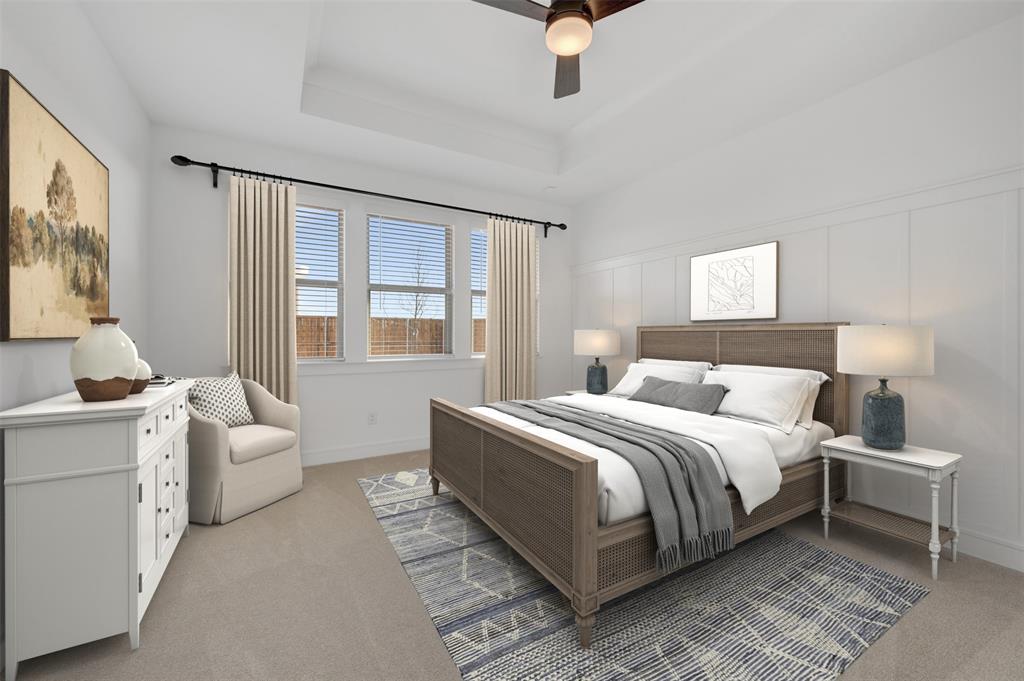 1014 Butterfly Lane Justin, TX 76247 - Photo 11 of 40 a bedroom with a bed and a couch