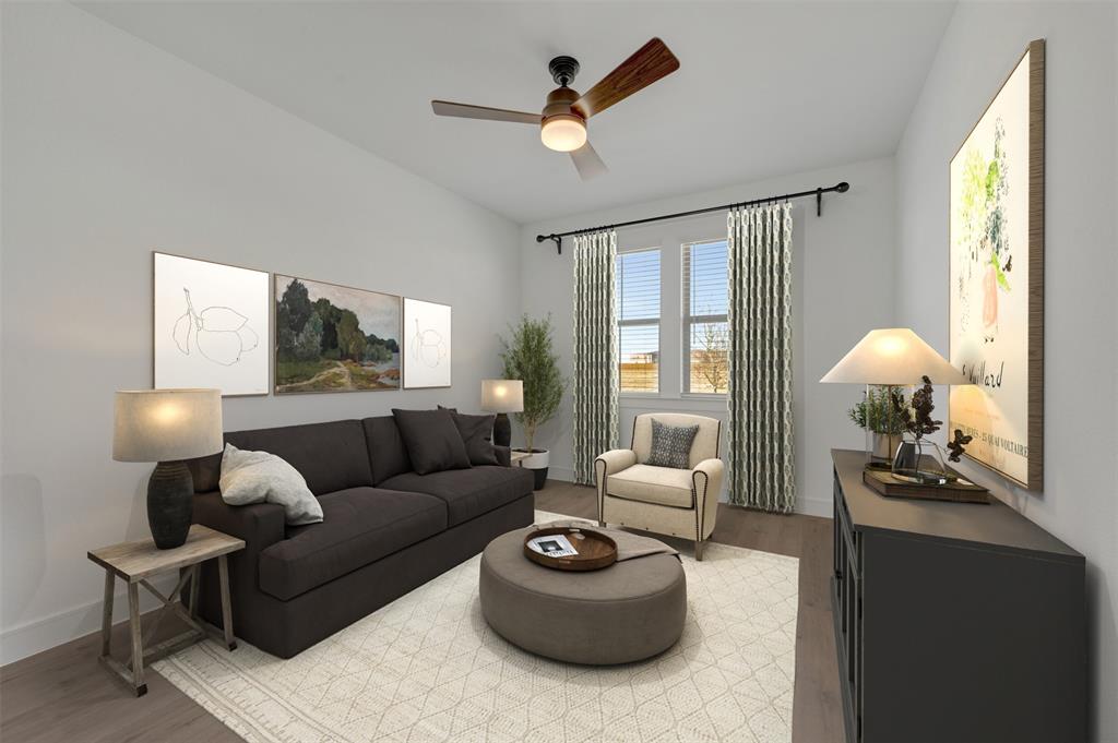 1014 Butterfly Lane Justin, TX 76247 - Photo 18 of 40 a living room with furniture a chandelier and a window