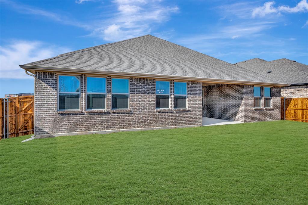 1014 Butterfly Lane Justin, TX 76247 - Photo 29 of 40 a front view of a house with a yard