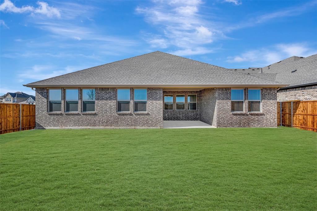 1014 Butterfly Lane Justin, TX 76247 - Photo 30 of 40 a front view of a house with a garden