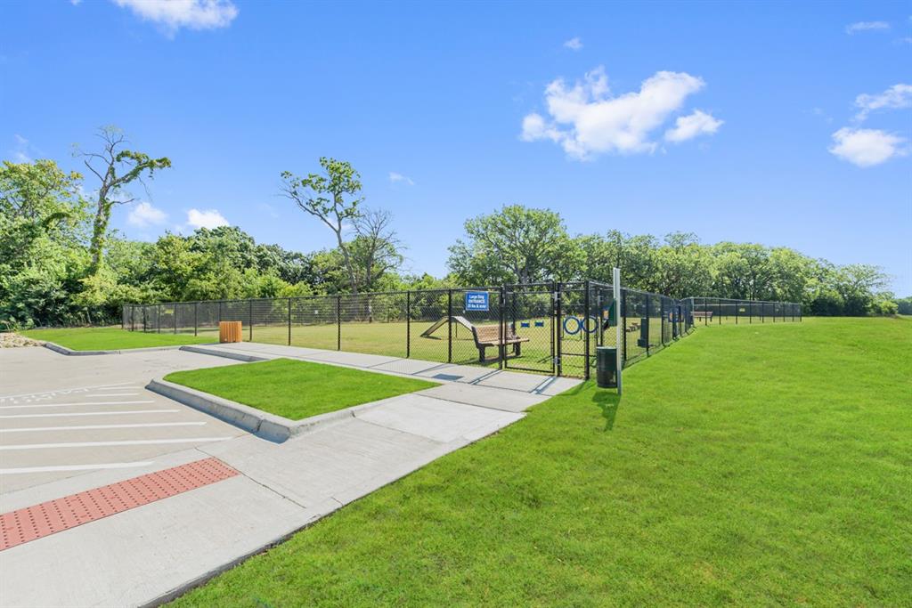 1014 Butterfly Lane Justin, TX 76247 - Photo 35 of 40 a view of a golf course with a lake
