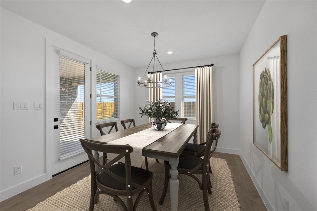 1014 Butterfly Lane Justin, TX 76247 - Photo 10 of 40 a view of a dining room with furniture window and wooden floor