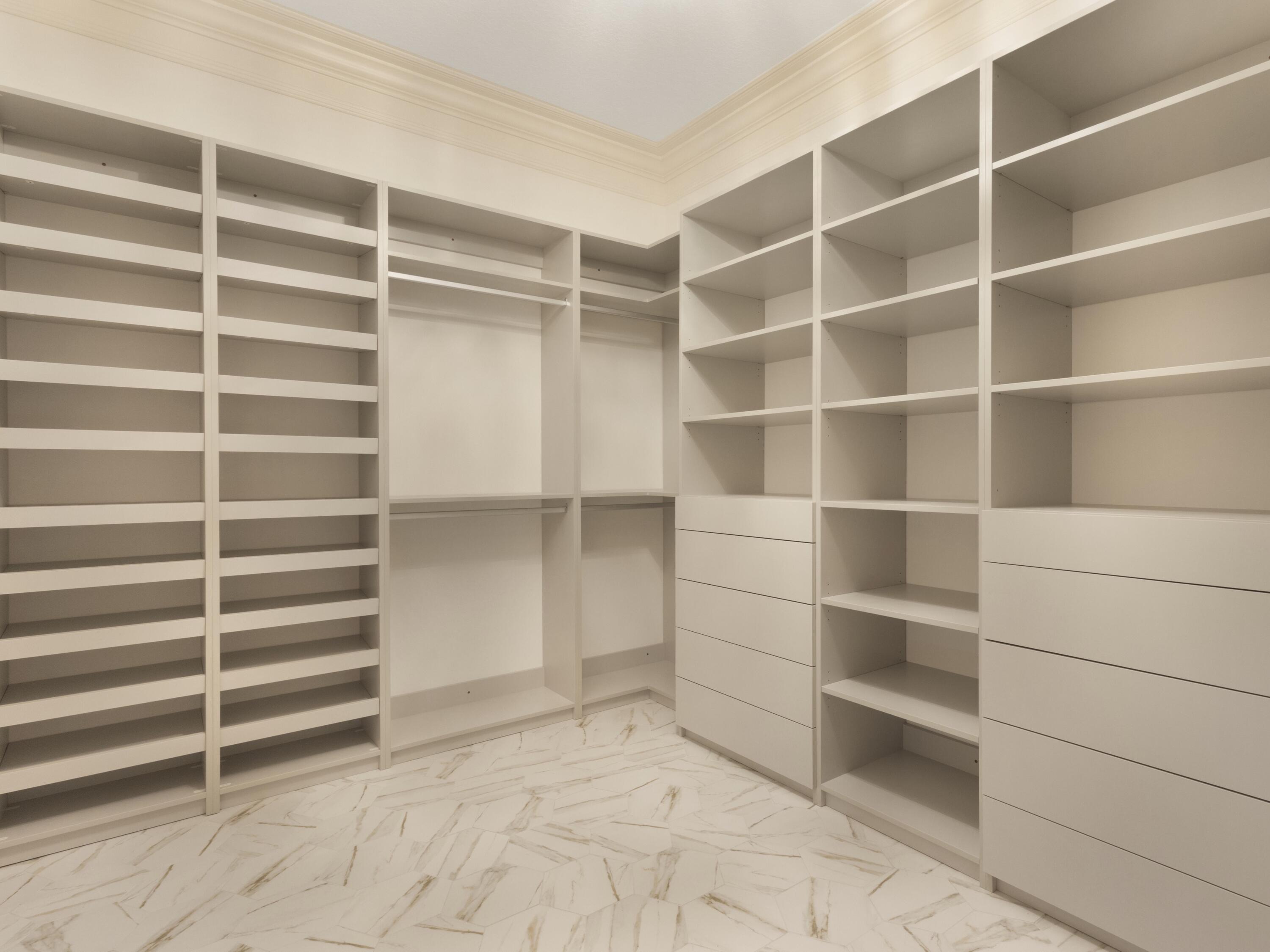 17436 71st Lane North Loxahatchee, FL 33470 - Photo 34 of 50 a view of walk in closet with empty racks