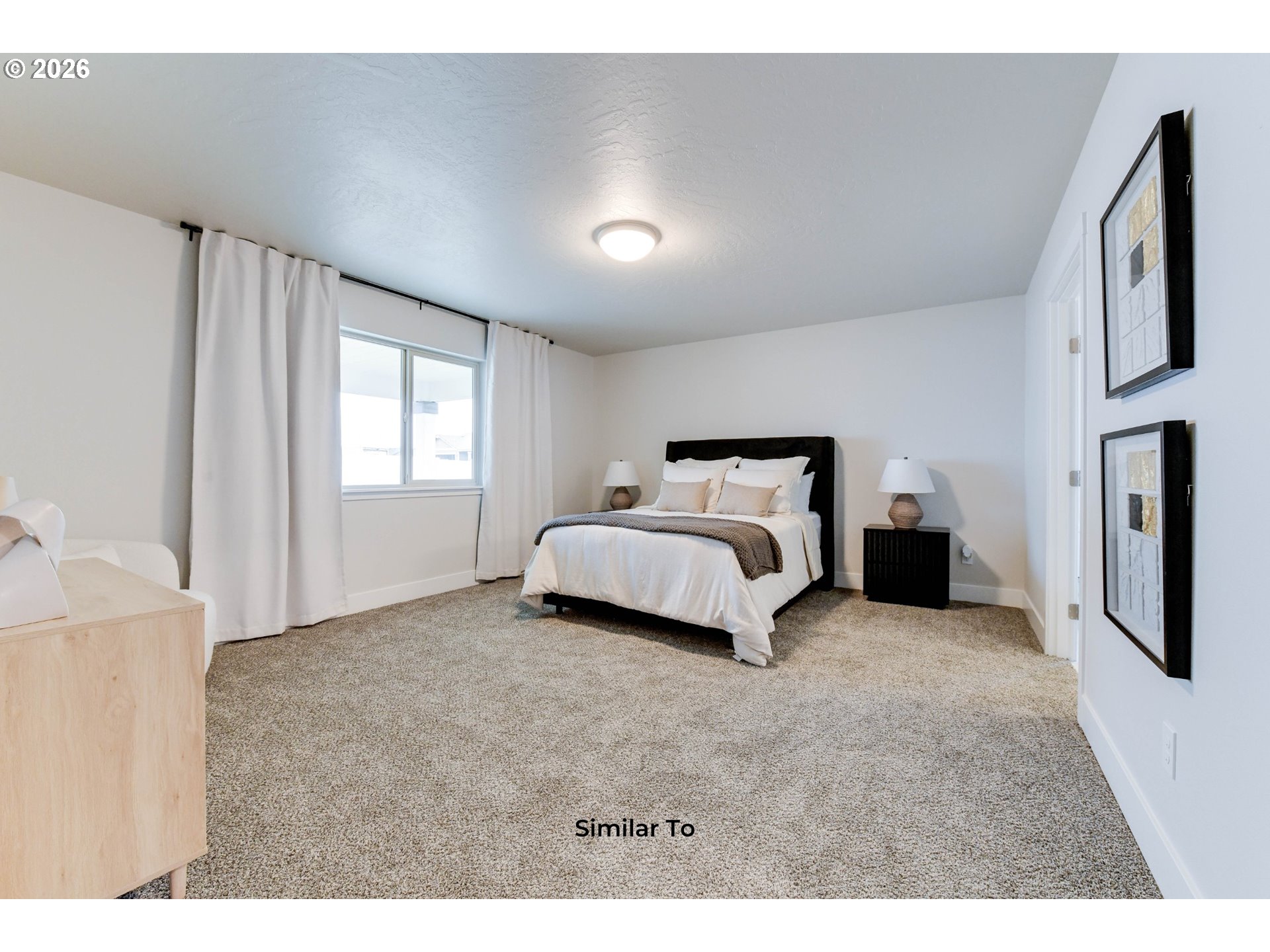 227 Southwest Goldfinch Lane Boardman, OR 97818 - Photo 17 of 28 a spacious bedroom with a bed and a cabinets