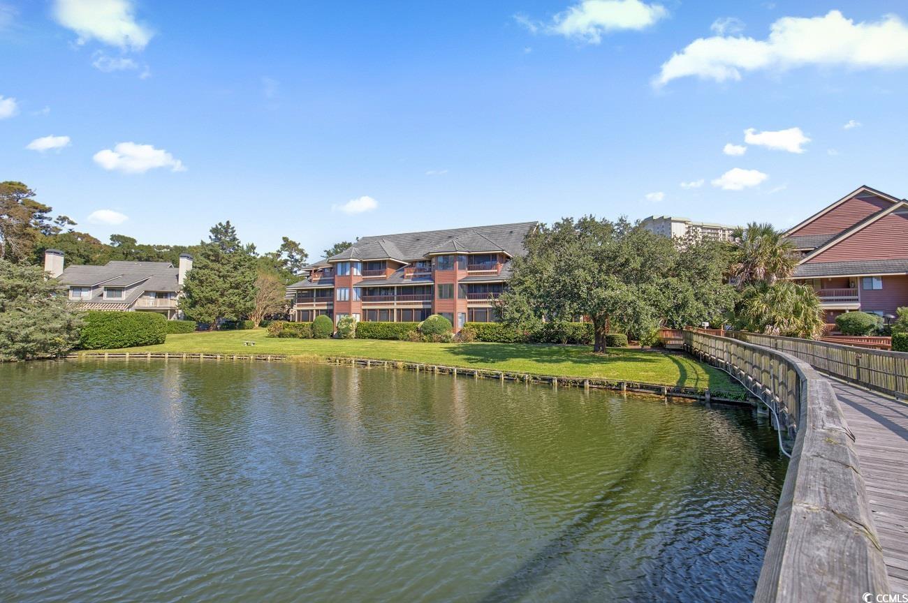 180 Rothbury Circle, Unit 215 Myrtle Beach, SC 29572 - Photo 1 of 34 Arrowhead Court serene natural lake location with footbridge to community pool