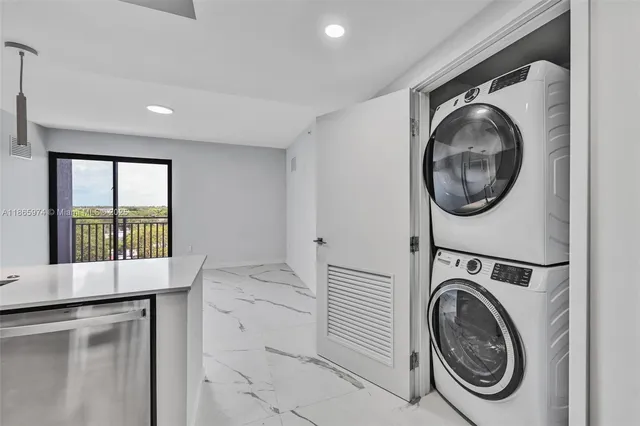 a view of a hallway with washer and dryer
