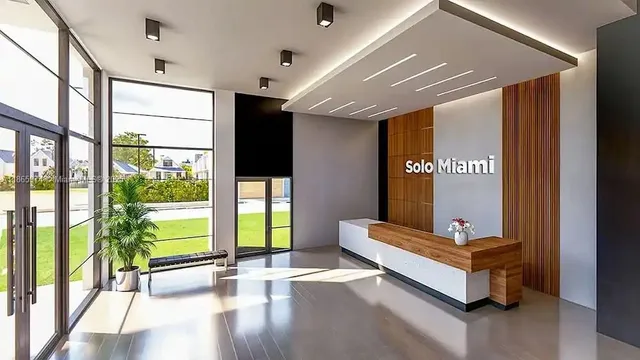 a swimming pool with outdoor seating and yard