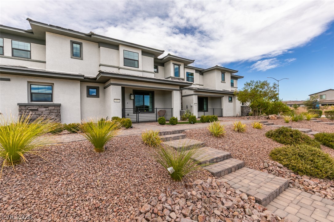 653 Pickled Pepper Place Henderson, NV 89011 - Photo 2 of 35 Modern facade and low-maintenance landscaping create an inviting desert oasis.