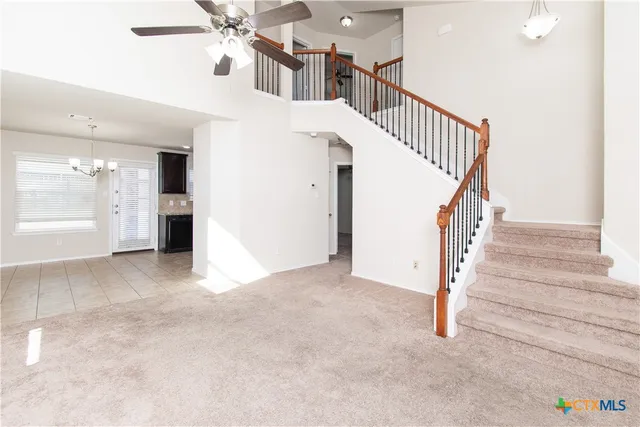 a view of a hallway with staircase