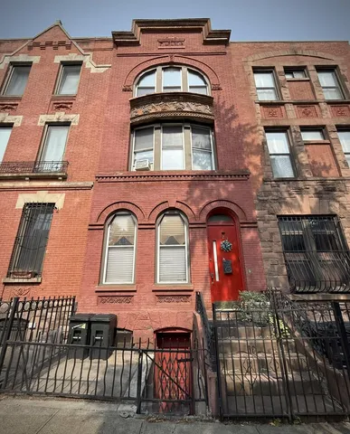 a front view of a house with glass windows