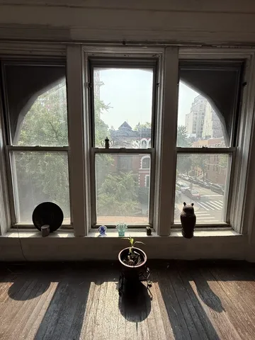 a view of a porch with furniture and a window