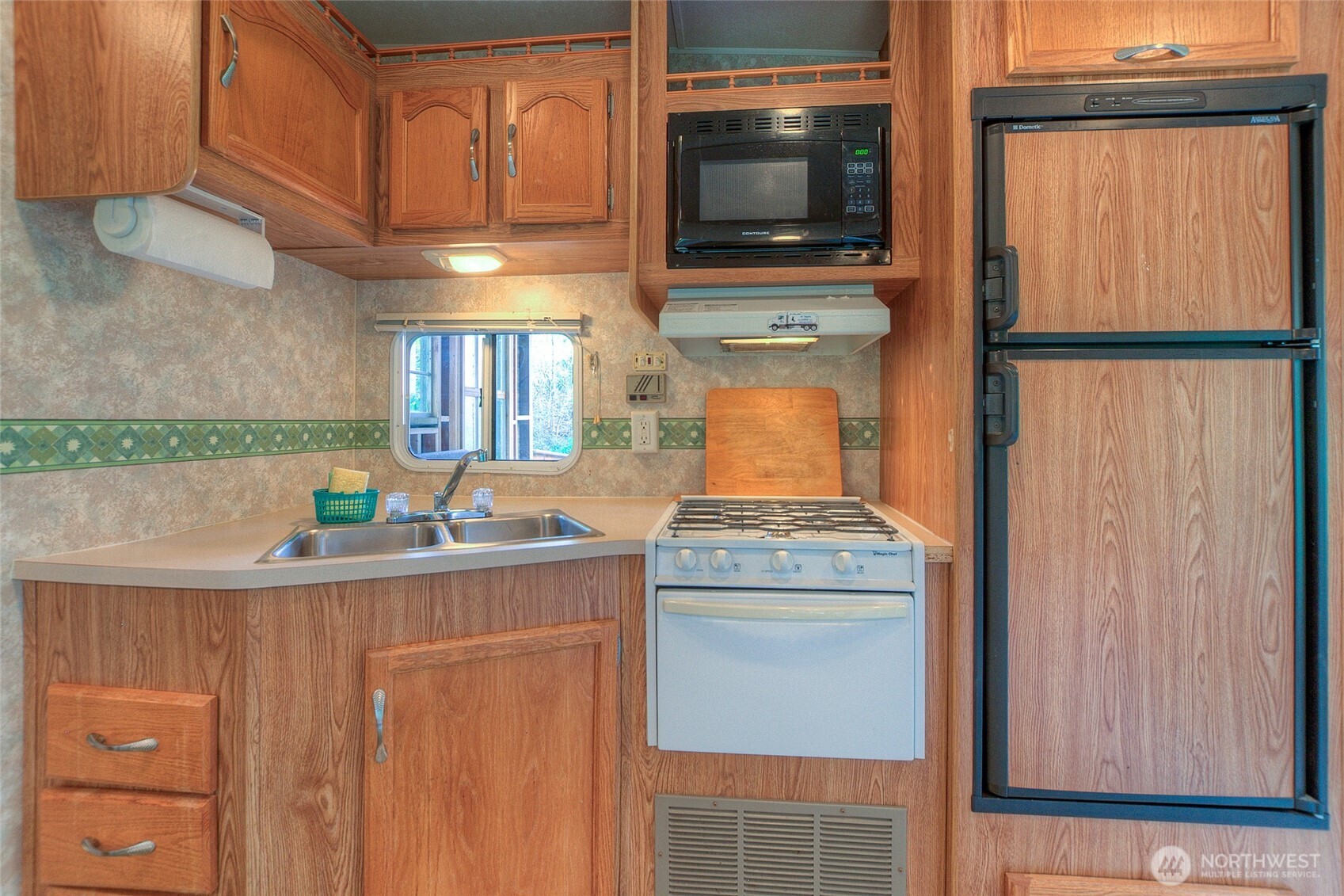 67 Frances Lane Lopez Island, WA 98261 - Photo 12 of 32 a kitchen with a stove and a microwave