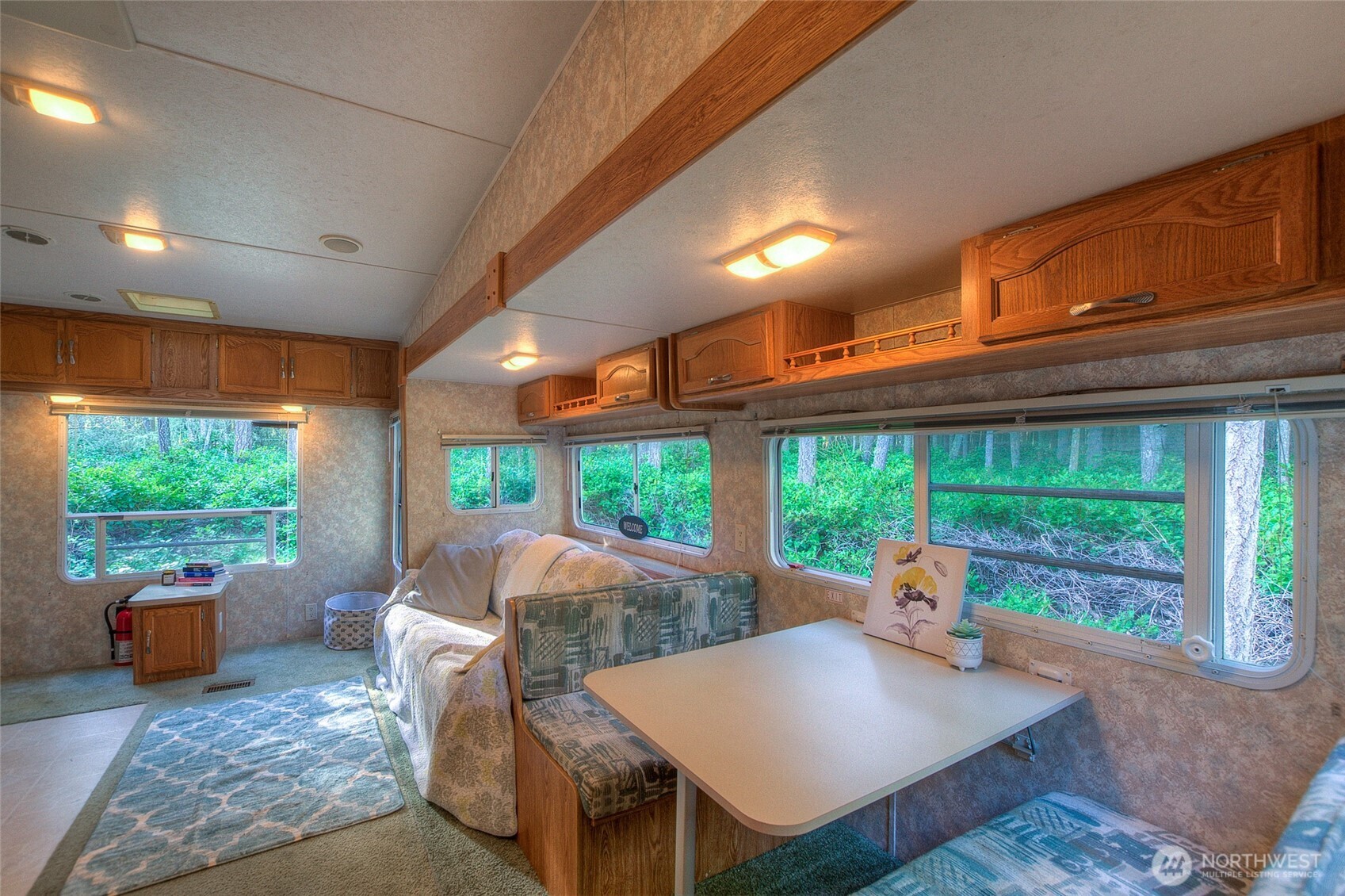 67 Frances Lane Lopez Island, WA 98261 - Photo 15 of 32 a living room with furniture and a large window