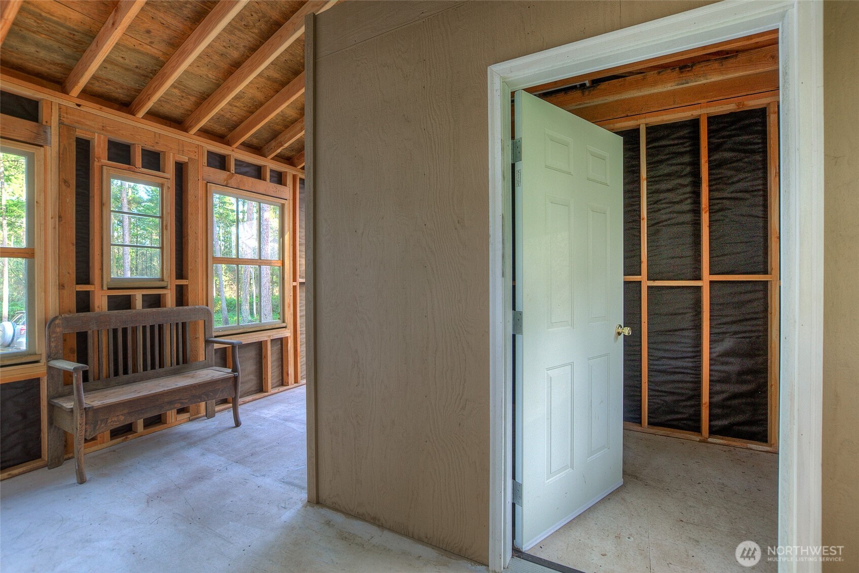 67 Frances Lane Lopez Island, WA 98261 - Photo 16 of 32 a view of porch with a door and a rug
