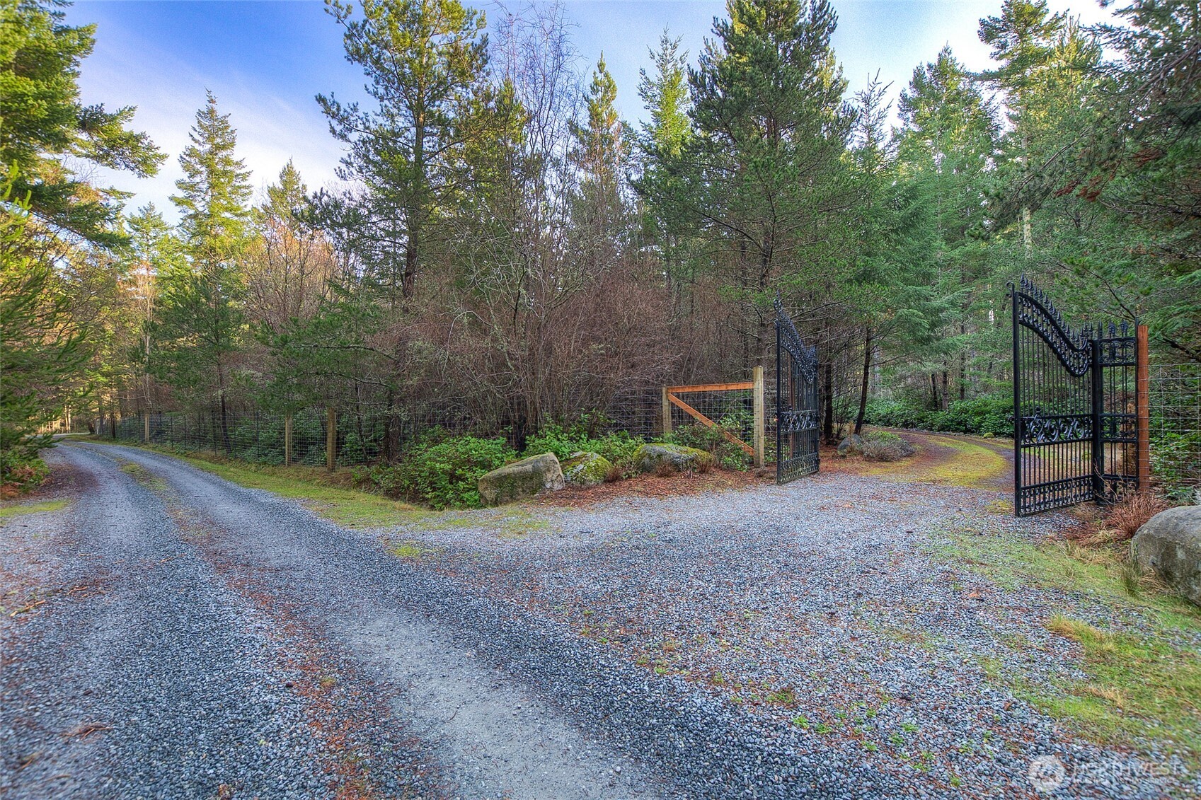 67 Frances Lane Lopez Island, WA 98261 - Photo 23 of 32 a view of a field with trees in the background