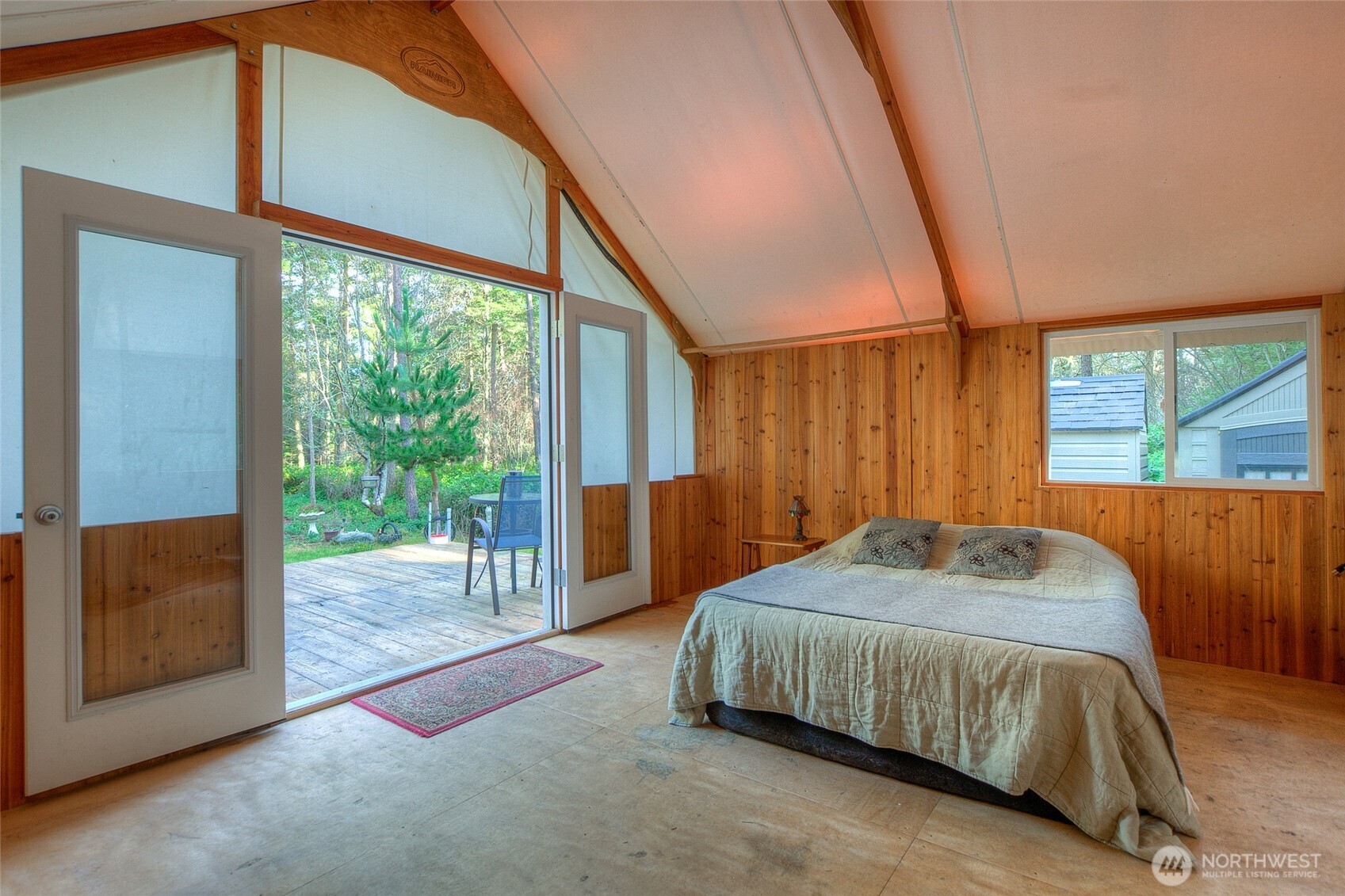 67 Frances Lane Lopez Island, WA 98261 - Photo 7 of 32 a bedroom with a bed and a large window