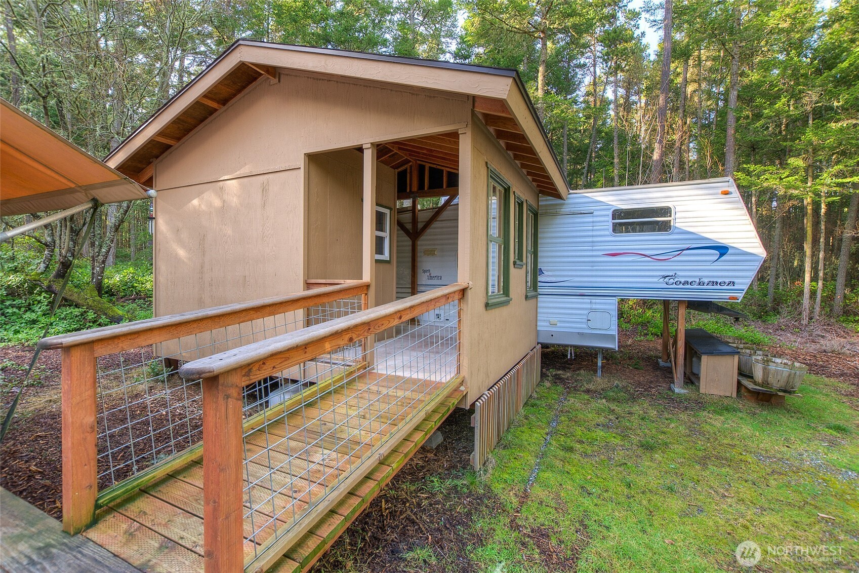 67 Frances Lane Lopez Island, WA 98261 - Photo 8 of 32 a view of a wooden deck and a backyard