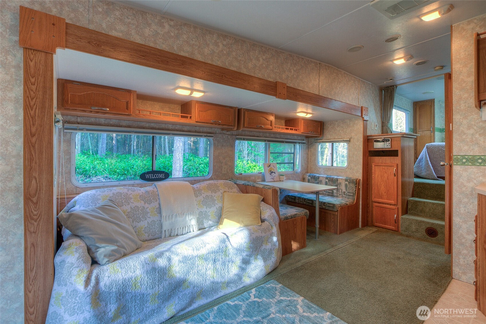 67 Frances Lane Lopez Island, WA 98261 - Photo 10 of 32 a living room with a couch and a large window
