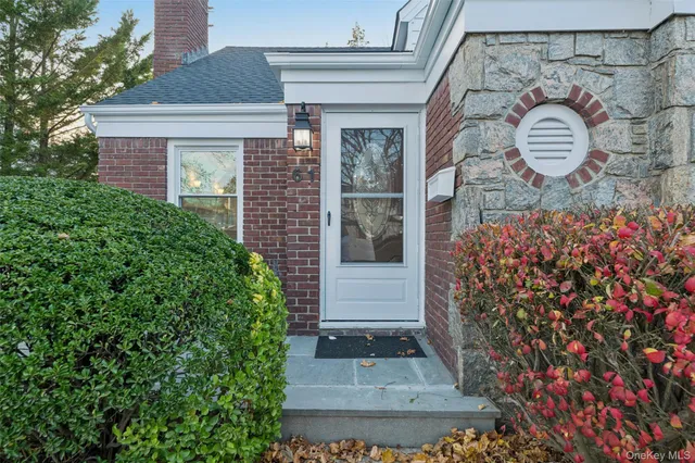 front view of a house with a potted plant