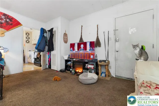 a kitchen with stainless steel appliances granite countertop a refrigerator and a stove