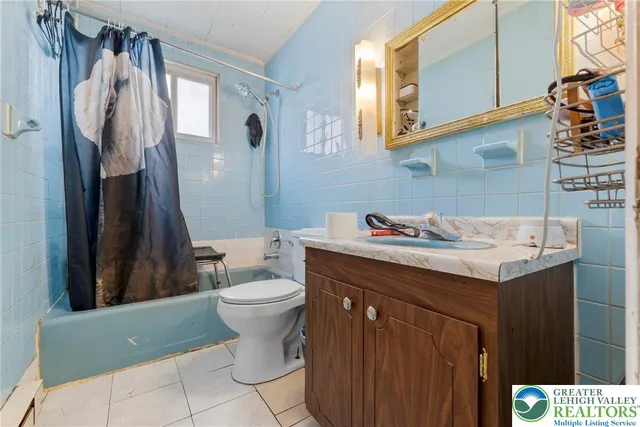 a bedroom with bed and a couch