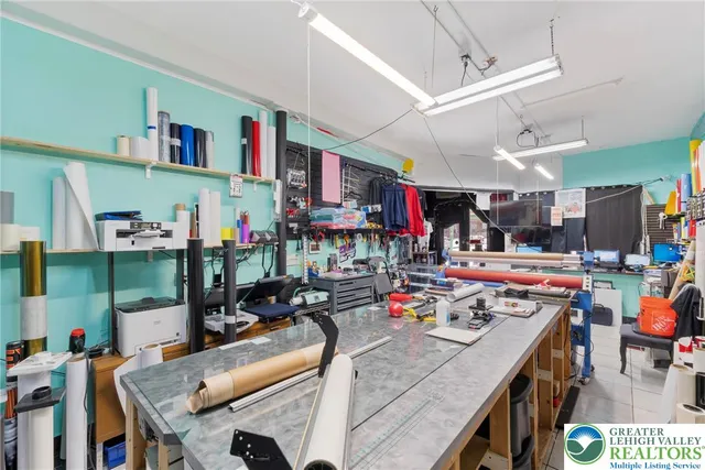 a room with lots of storage and a fan