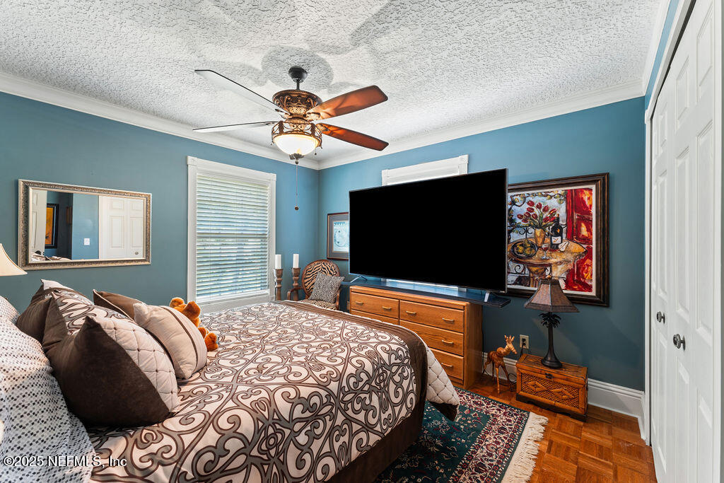 43 Valencia Street St. Augustine, FL 32084 - Photo 33 of 48 a bedroom with a bed and a flat screen tv