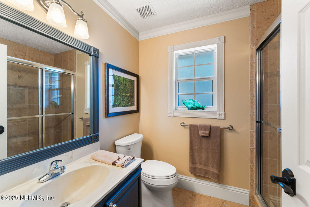 43 Valencia Street St. Augustine, FL 32084 - Photo 34 of 48 a bathroom with a sink toilet and shower