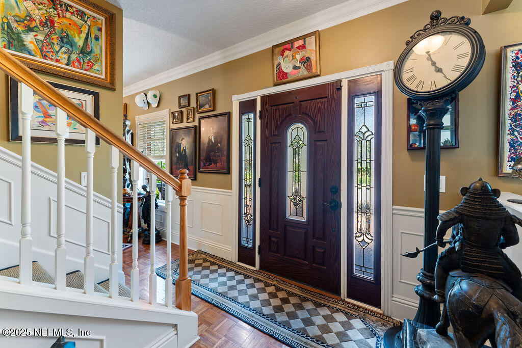 43 Valencia Street St. Augustine, FL 32084 - Photo 6 of 48 a view of a hallway with wooden floor and staircase