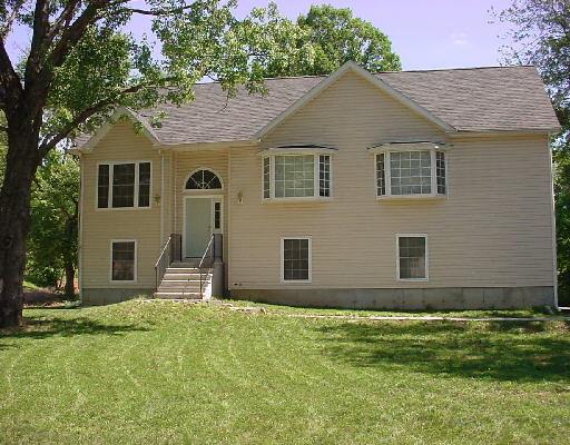 128 Armstrong Road Shelton, CT 06484 - Photo 1 of 1 a front view of a house with garden