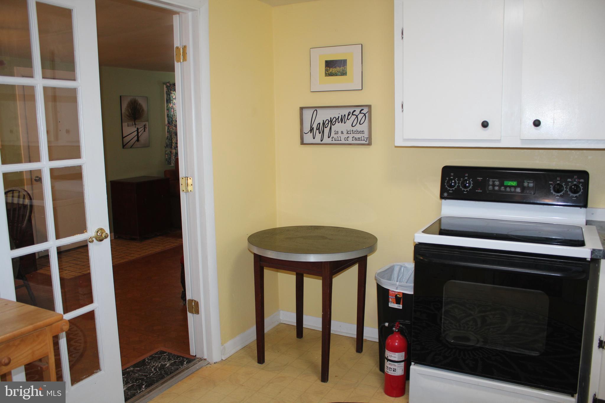 12439 West Torquay Road Ocean City, MD 21842 - Photo 12 of 24 Kitchen with double doors to dining area