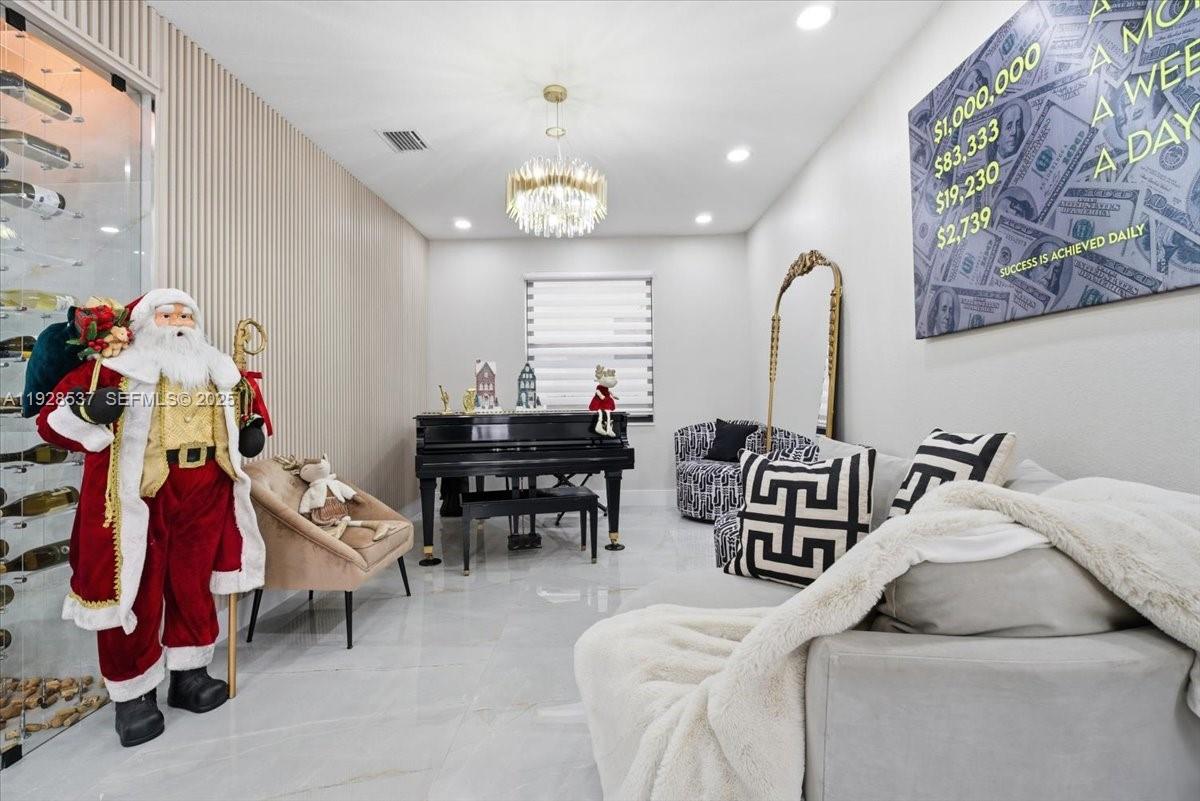 3522 West 86th Terrace Hialeah, FL 33018 - Photo 15 of 35 a bedroom with furniture and a chair