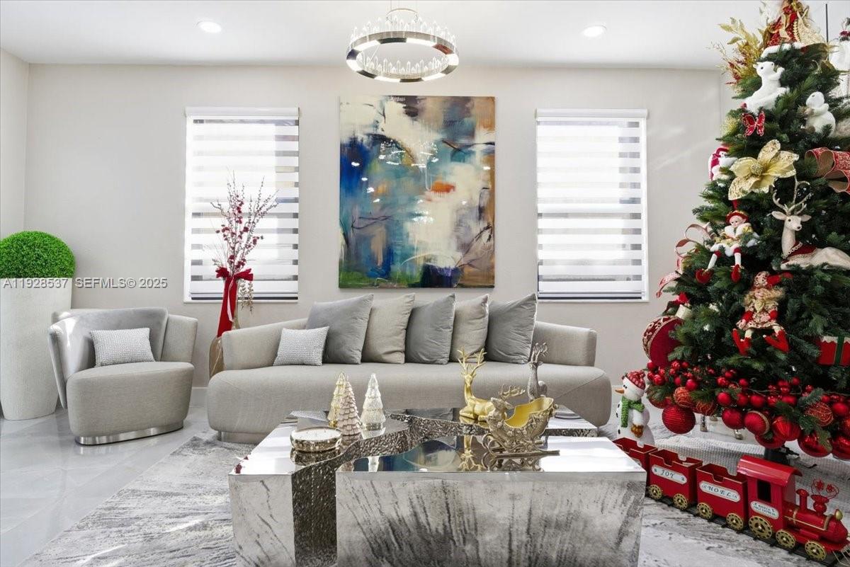 3522 West 86th Terrace Hialeah, FL 33018 - Photo 17 of 35 a living room with furniture flowers and a window