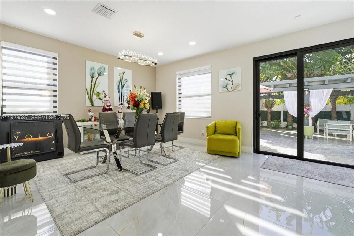 3522 West 86th Terrace Hialeah, FL 33018 - Photo 19 of 35 a living room with furniture window and wooden floor