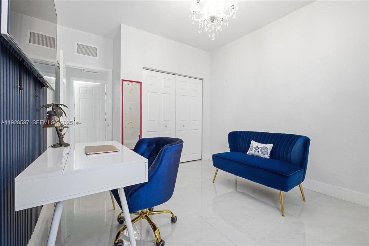 3522 West 86th Terrace Hialeah, FL 33018 - Photo 30 of 35 a view of a livingroom with furniture and a table