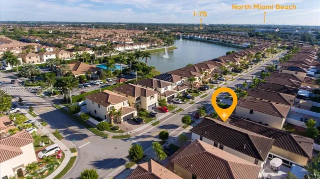 an aerial view of a house with a swimming pool yard and outdoor seating