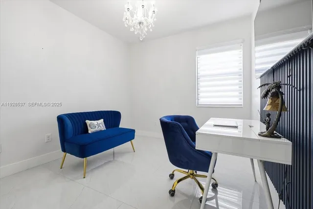 a bedroom with a bed couch and window