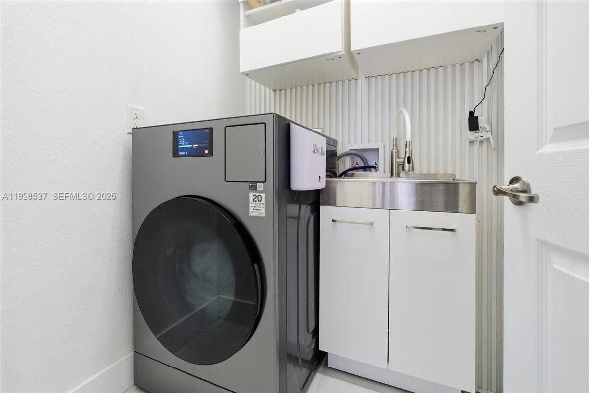 3522 West 86th Terrace Hialeah, FL 33018 - Photo 35 of 35 a utility room with dryer and washer