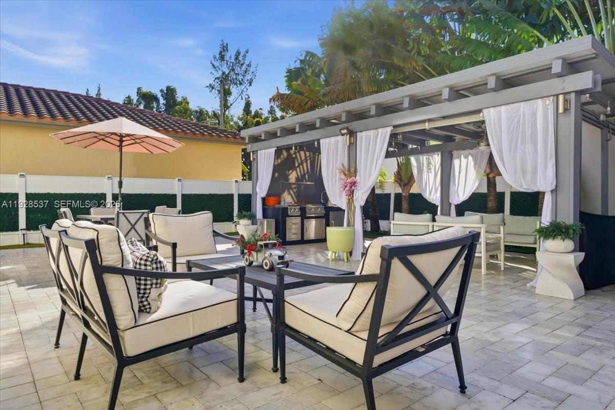 3522 West 86th Terrace Hialeah, FL 33018 - Photo 10 of 35 a view of a patio with a table and chairs