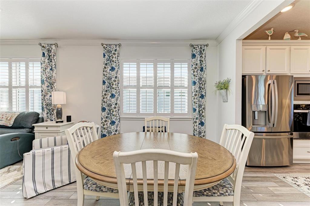 9272 Ballaster Pointe Loop Parrish, FL 34221 - Photo 14 of 79 a view of a dining room with furniture window and outside view